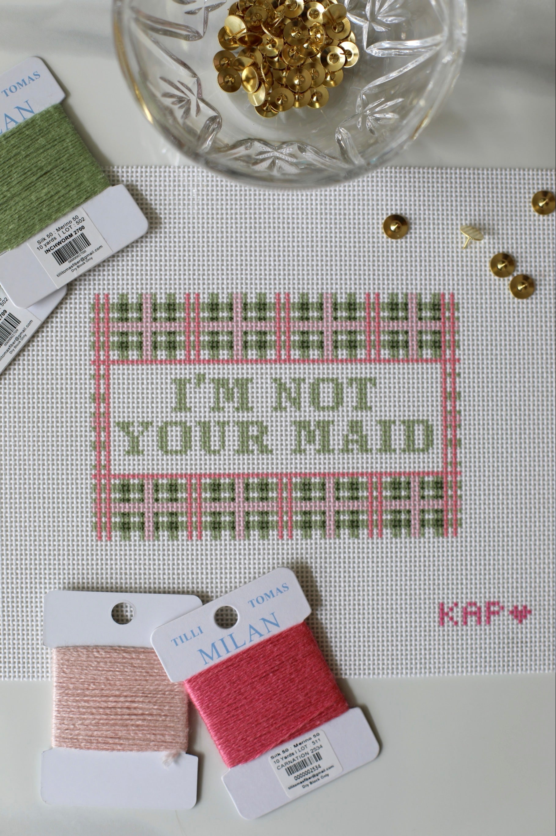 Angled view of I'm Not Your Maid needlepoint canvas for laundry room or mudroom