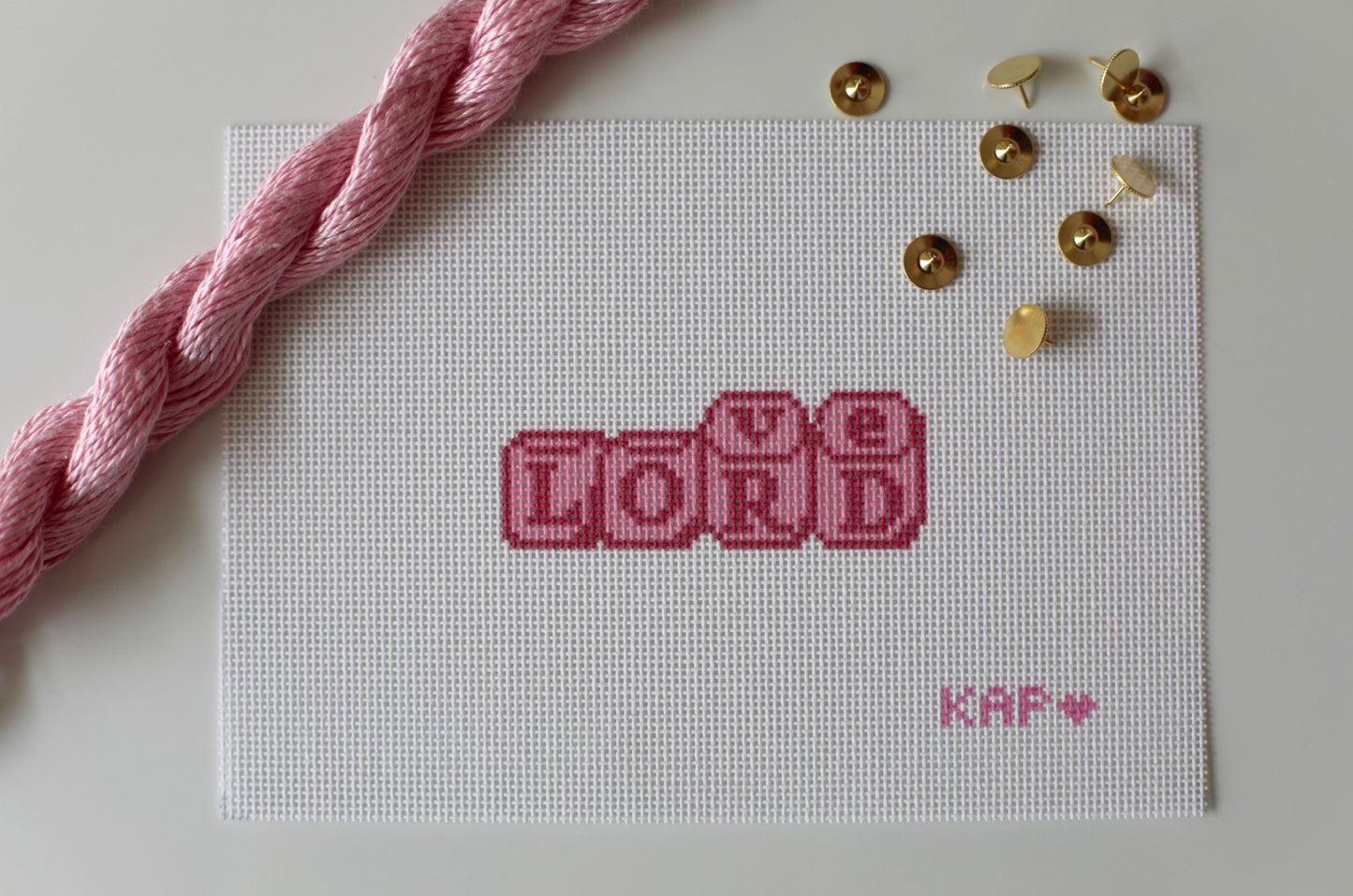 Love Lord Dice needlepoint canvas in blush tones on 18 mesh, 1.5x3.5 design