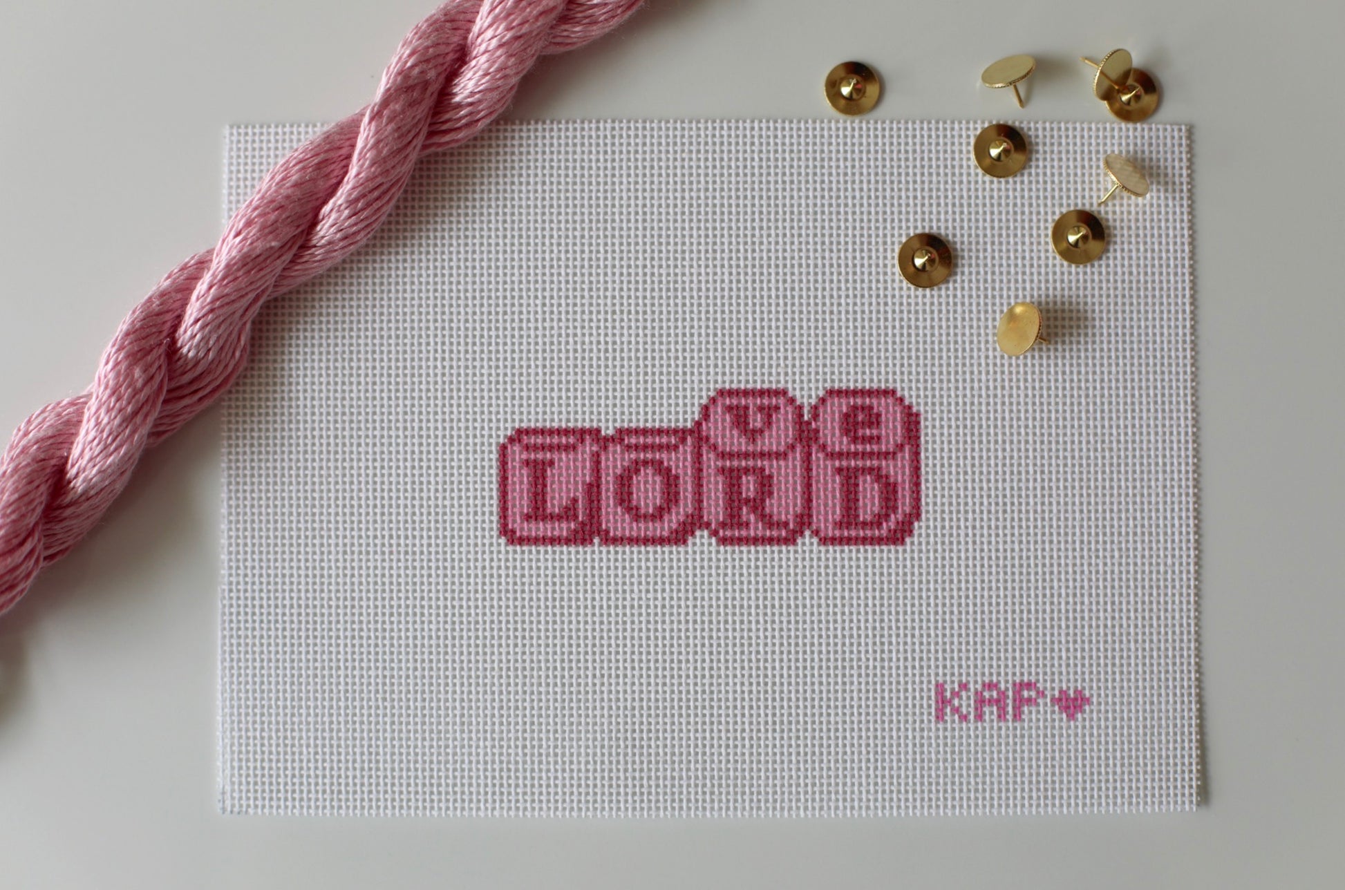 Love Lord Dice needlepoint canvas in blush tones on 18 mesh, 1.5x3.5 design