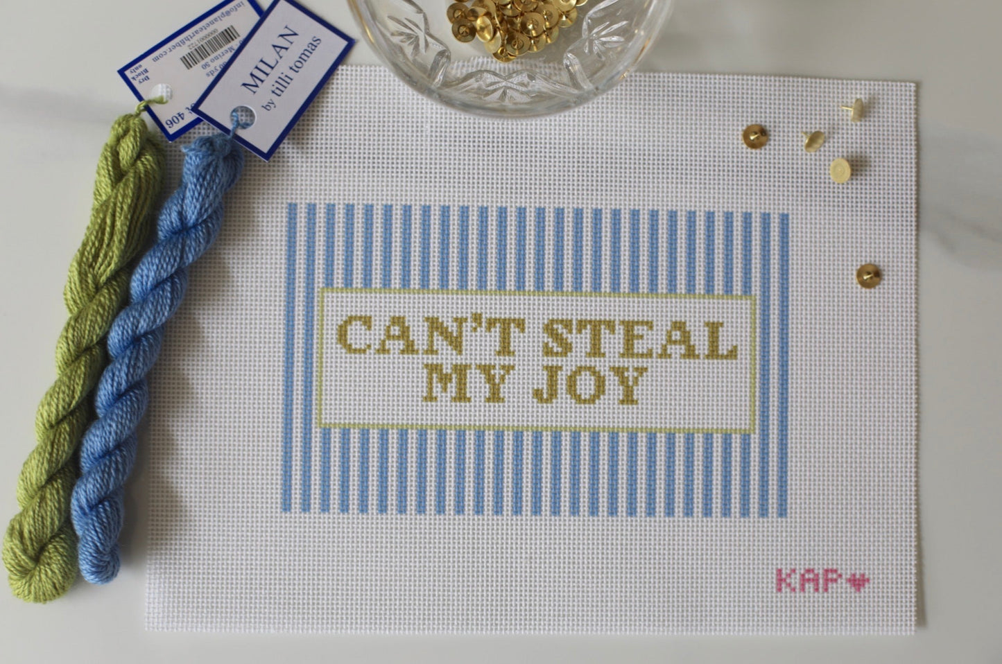 Angled view of Can't Steal My Joy needlepoint canvas showing pillow finishing potential