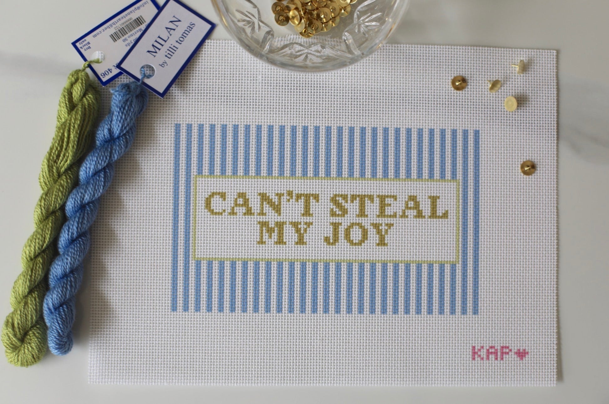 Angled view of Can't Steal My Joy needlepoint canvas showing pillow finishing potential